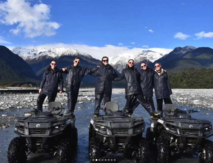 Quad bikes crossing river flats near Franz Josef village
